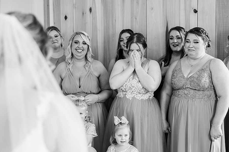 Bridesmaids crying at first look at Allenbrooke Farm wedding by Amanda May Photos