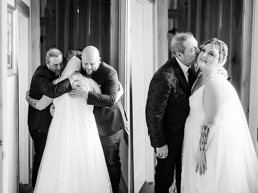 Bride and family hugging at Allenbrooke Farm wedding by Amanda May Photos