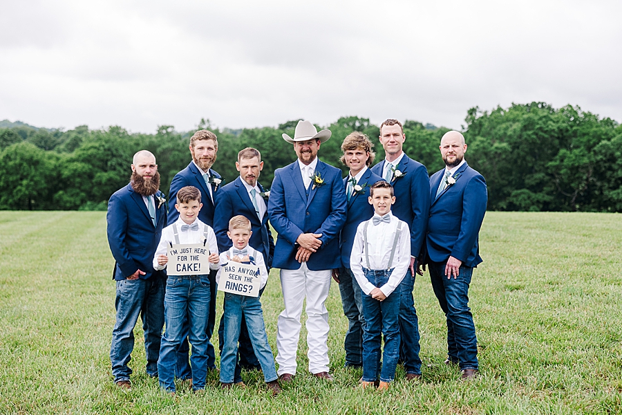 Groom standing with groomsmen and ring bearers at Allenbrooke Farm wedding by Amanda May Photos