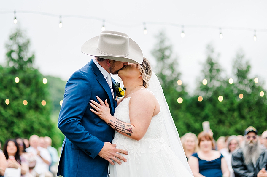 Bride and groom kiss at Allenbrooke Farm wedding by Amanda May Photos