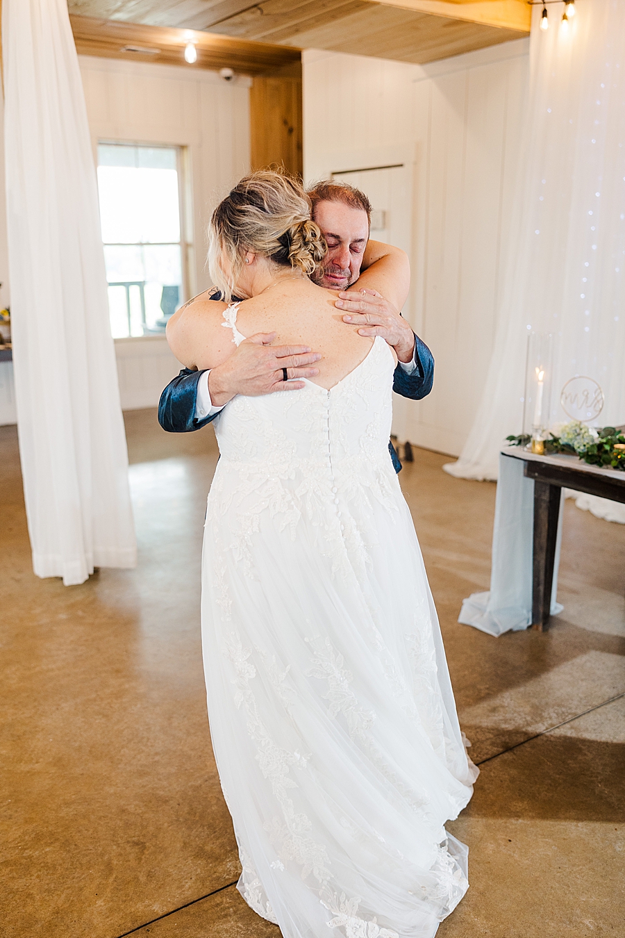 Bride and dad hug at wedding by Amanda May Photos