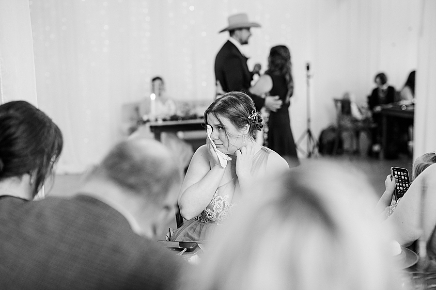Bridesmaid crying at wedding by Amanda May Photos