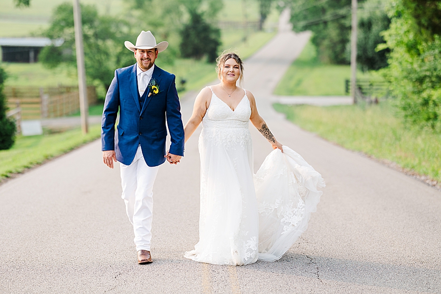 Walking together at wedding by Amanda May Photos