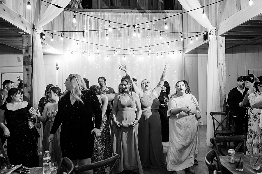 Guests dancing at wedding by Amanda May Photos
