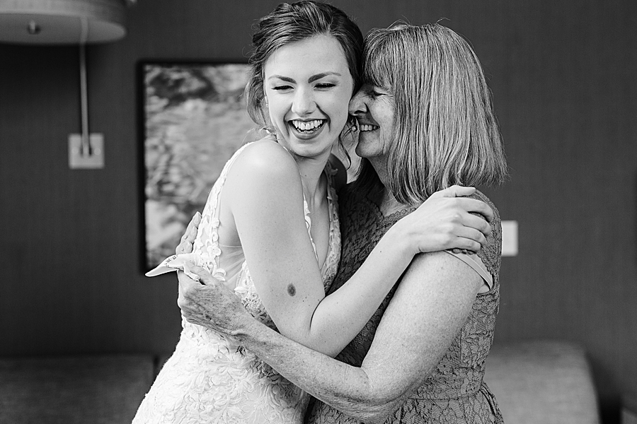 bride hugging mom at emporium wedding