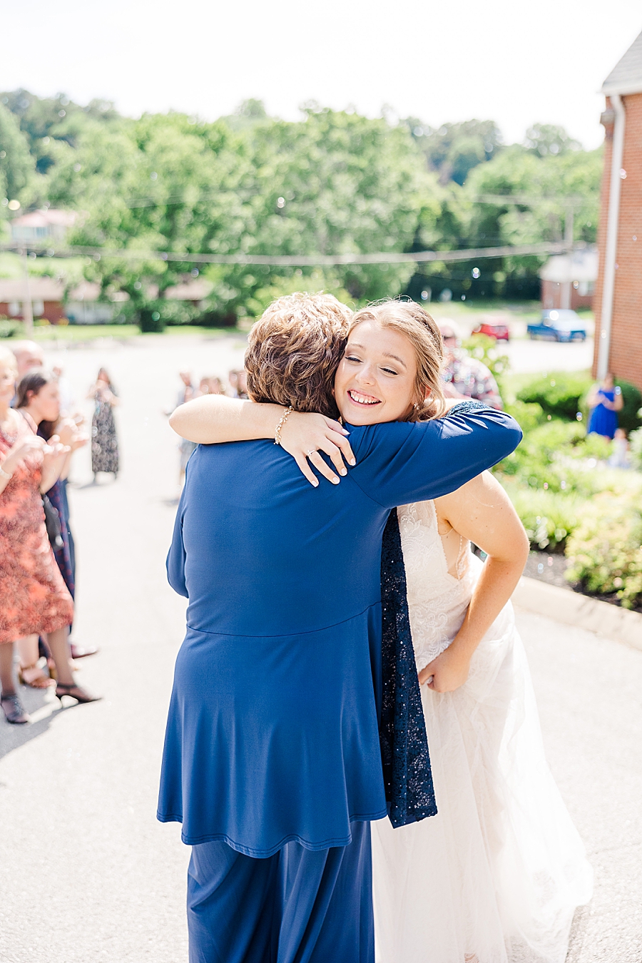 bride hugging guest after erin presbyterian church wedding