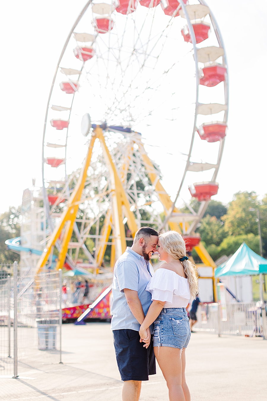 by the ferris wheel at this fair engagement session
