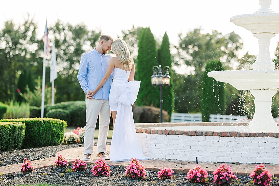 couple standing by water fountain