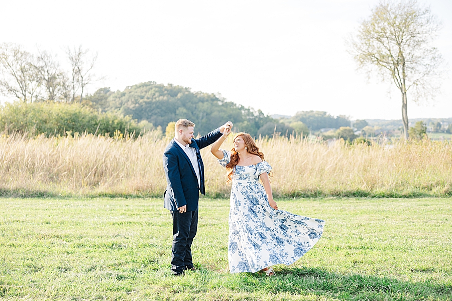 twirling during fall marblegate farm engagement