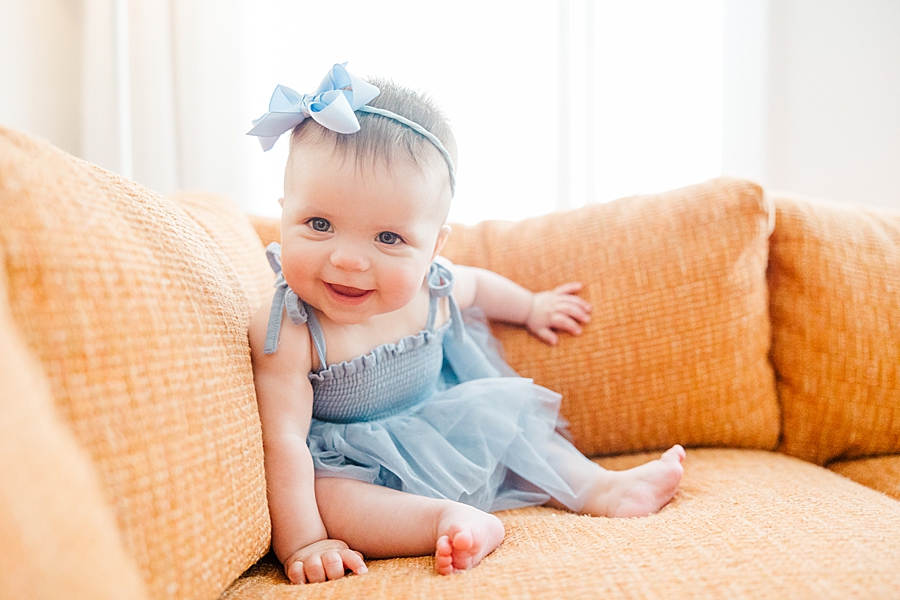 Baby smiling on couch at Old North Home Lifestyle Session by Amanda May Photos