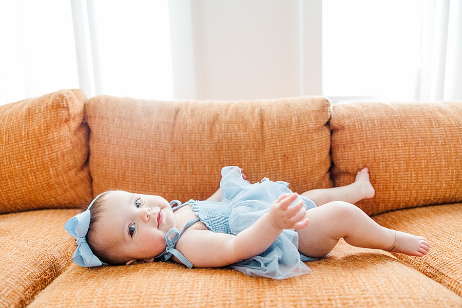 Baby laying on couch at Old North Home Lifestyle Session by Amanda May Photos