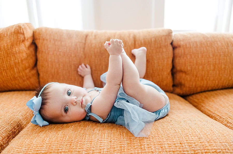 Baby holding feet at Old North Home Lifestyle Session by Amanda May Photos