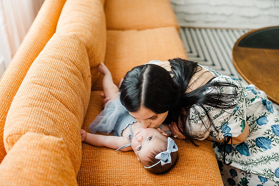 Mom kissing baby's cheek at Old North Home Lifestyle Session by Amanda May Photos