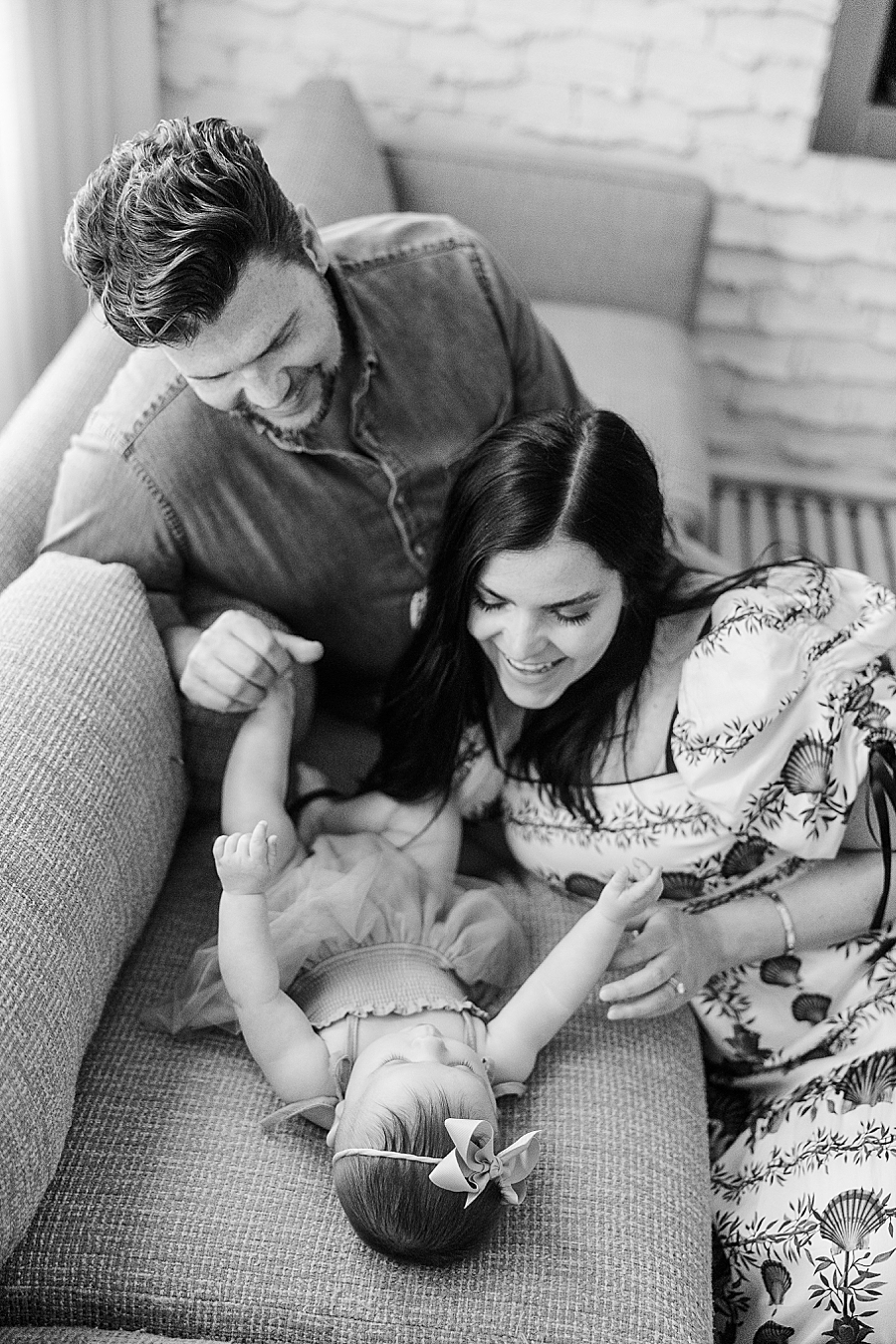 Mom and dad playing with baby at Home Lifestyle Session by Amanda May Photos