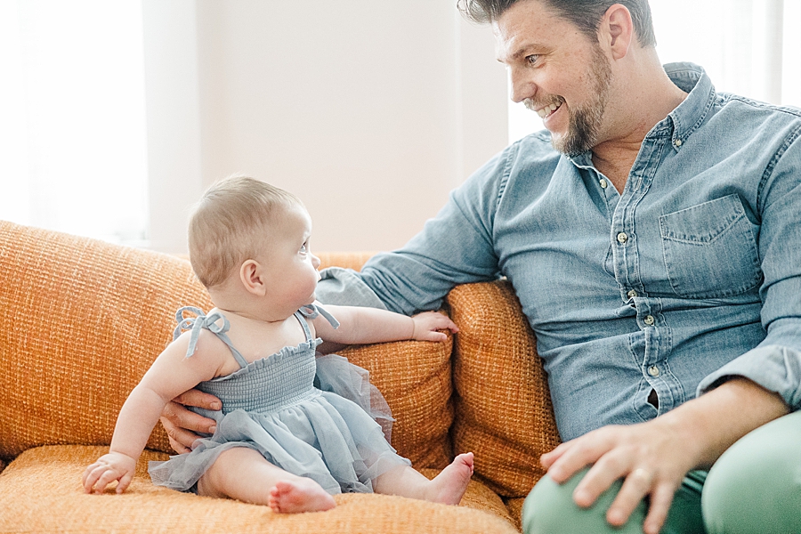 Dad and baby smiling together at Home Lifestyle Session by Amanda May Photos