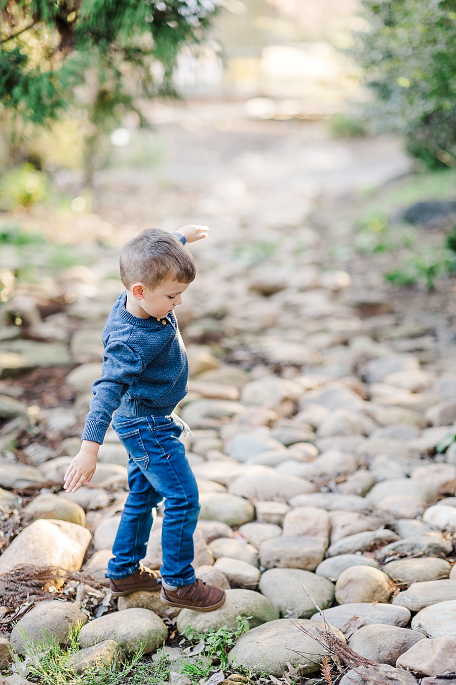 boy playing on rocks