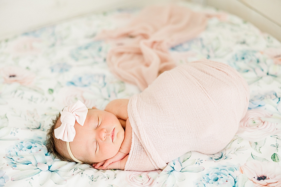 swaddled baby at floral newborn session