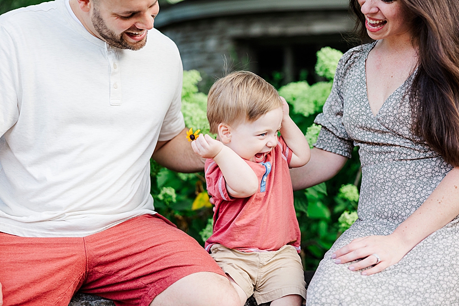 parents tickling little boy