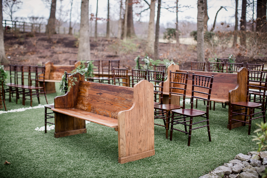 Church pews and wooden chairs for the ceremony at the open house of Knoxville Wedding Venue, Hunter Valley Farm, by Knoxville Wedding Photographer, Amanda May Photos.