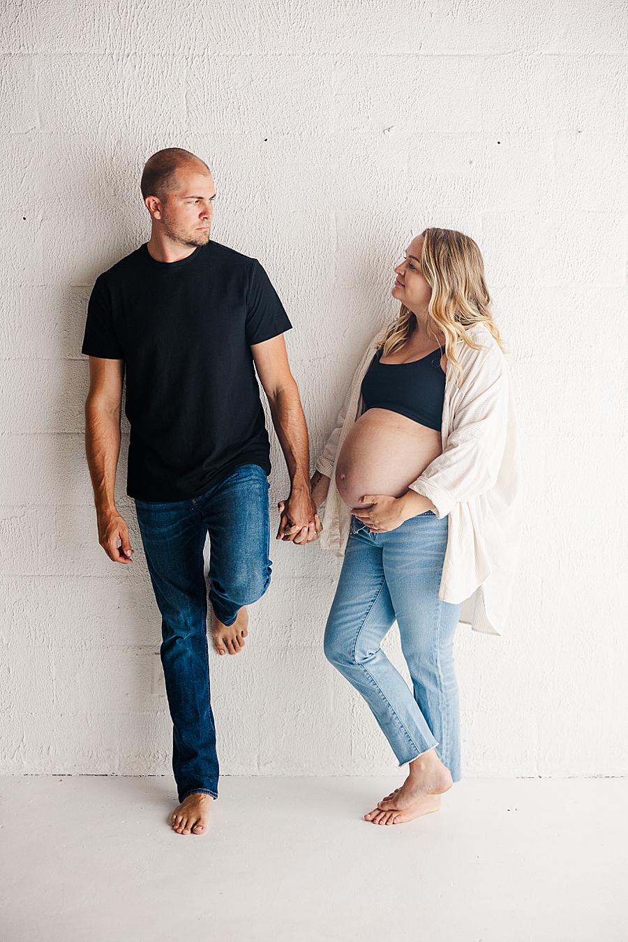holding hands at highlight studio maternity session