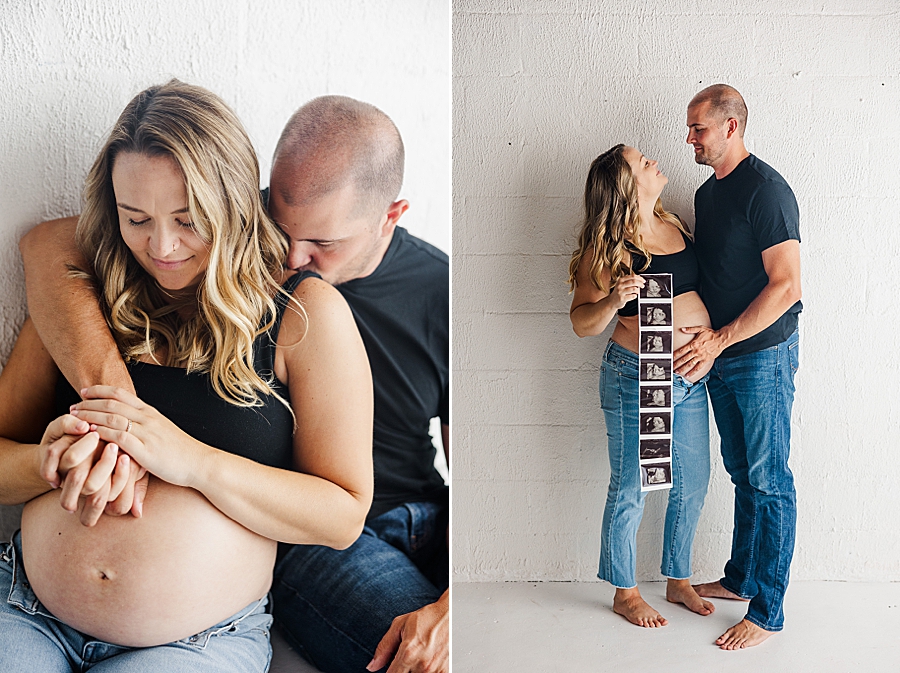 couple holding ultrasound photos