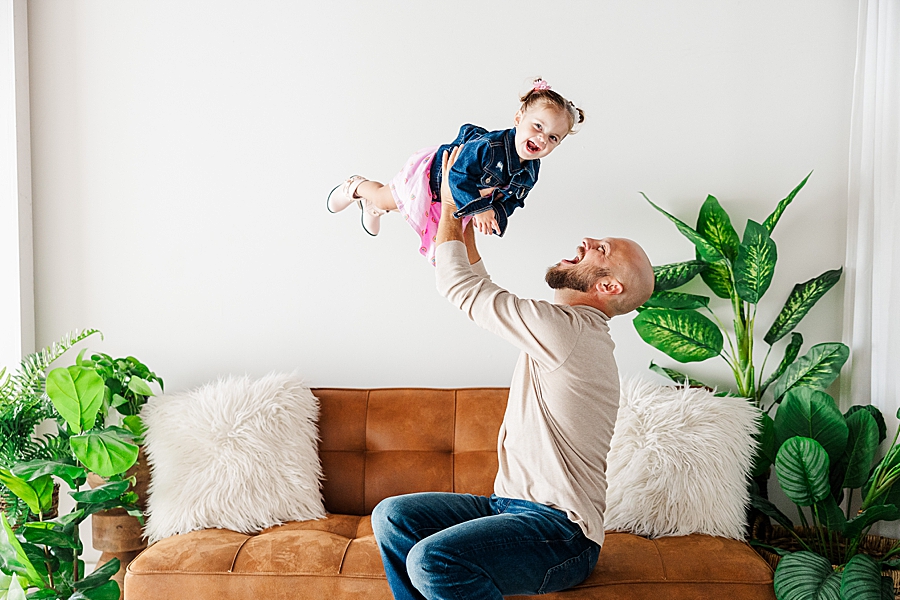 dad playing with daughter at highlight studio