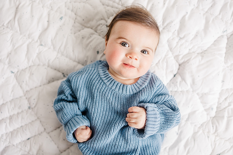 baby in chunky knit sweater