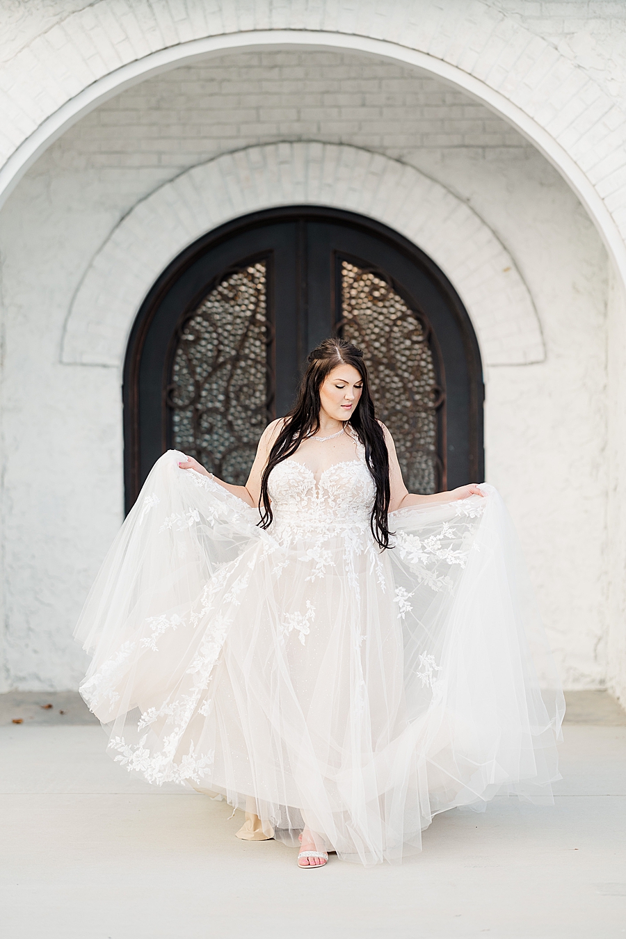 bride in fluffy white wedding dress