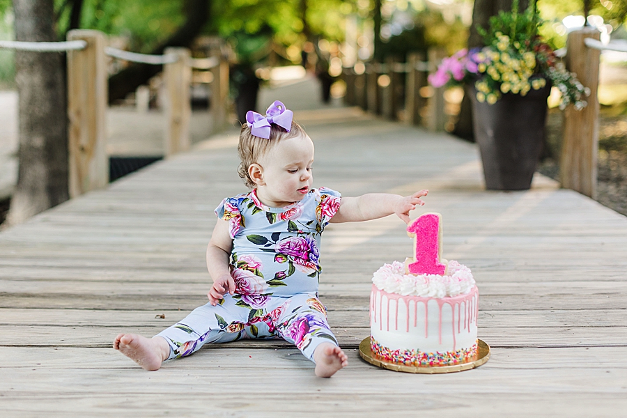 girl reaching for cake
