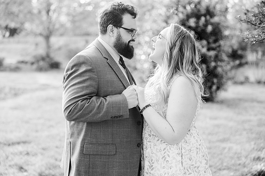 Smiling at each other at UT Gardens Engagement by Amanda May Photos