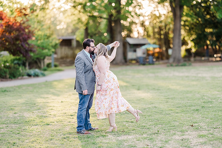 Leaning in for a kiss at engagement session by Amanda May Photos