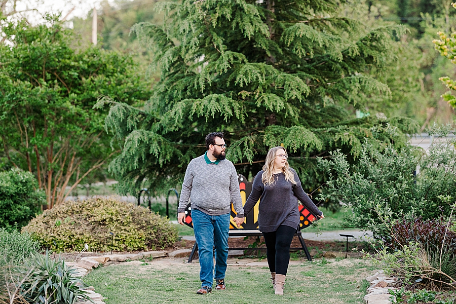 Holding hands and walking at engagement session by Amanda May Photos