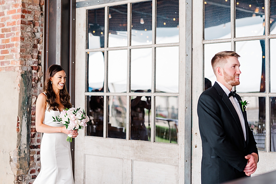 Bride and groom share a first look at Mill & Mine Wedding by Amanda May Photos