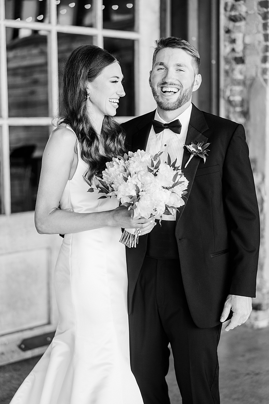 Bride and groom laughing together at Mill & Mine Wedding by Amanda May Photos