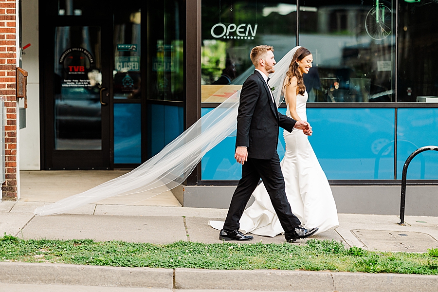 Walking down the sidewalk at Wedding by Amanda May Photos