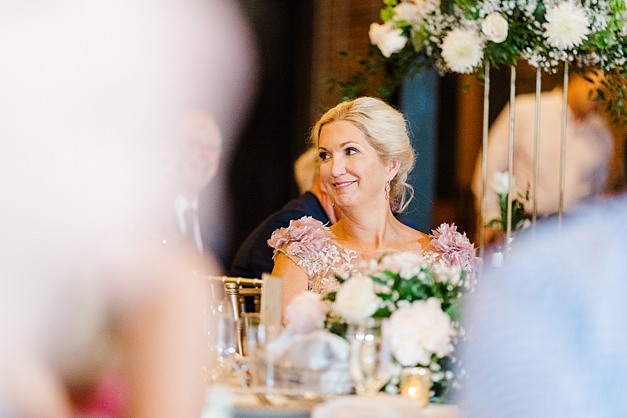 Guest smiling at Wedding by Amanda May Photos