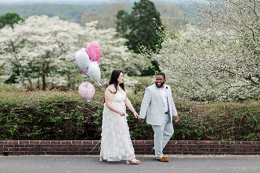 Walking with balloons at Garden Engagement Session by Amanda May Photos