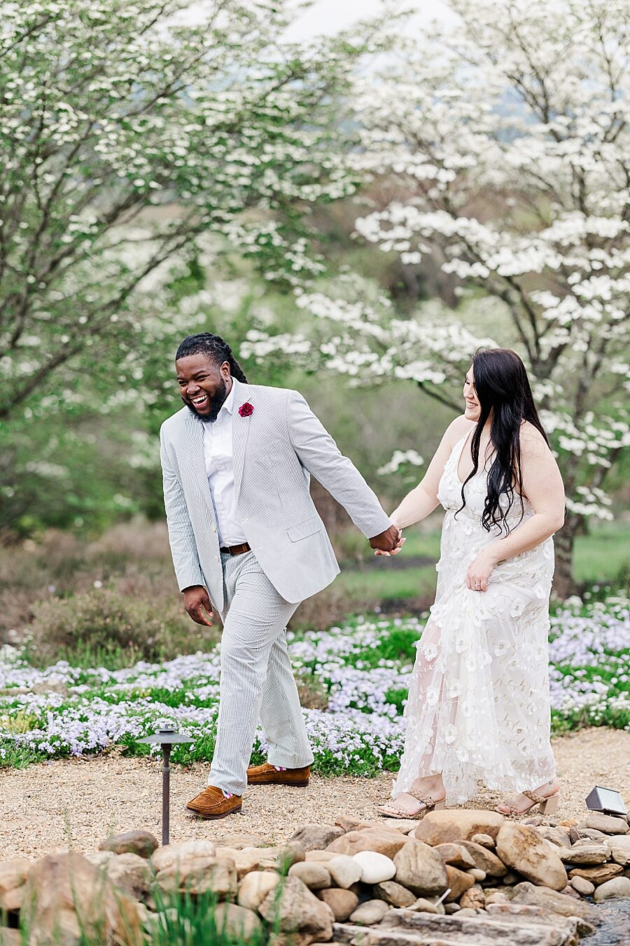 Walking together at Garden Engagement Session by Amanda May Photos