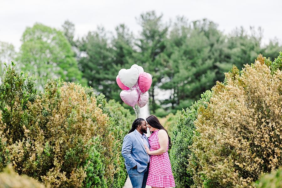 Holding balloons at Garden Engagement Session by Amanda May Photos
