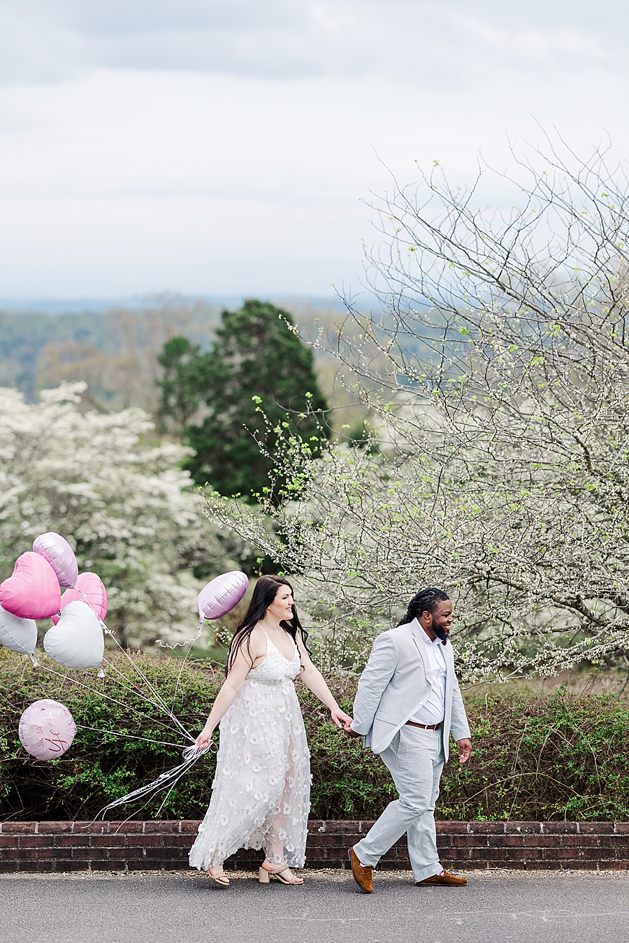 Walking with balloons at Garden Engagement Session by Amanda May Photos