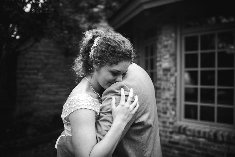 Hugging him so tight at this Windswept wedding by Knoxville Wedding Photographer, Amanda May Photos.