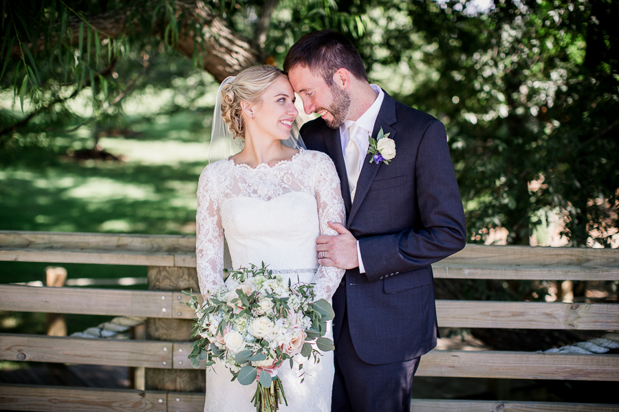 Hugging from the side at the Pavilion at Hunter Valley Farm Wedding shot by Knoxville Photographer, Amanda May Photos.