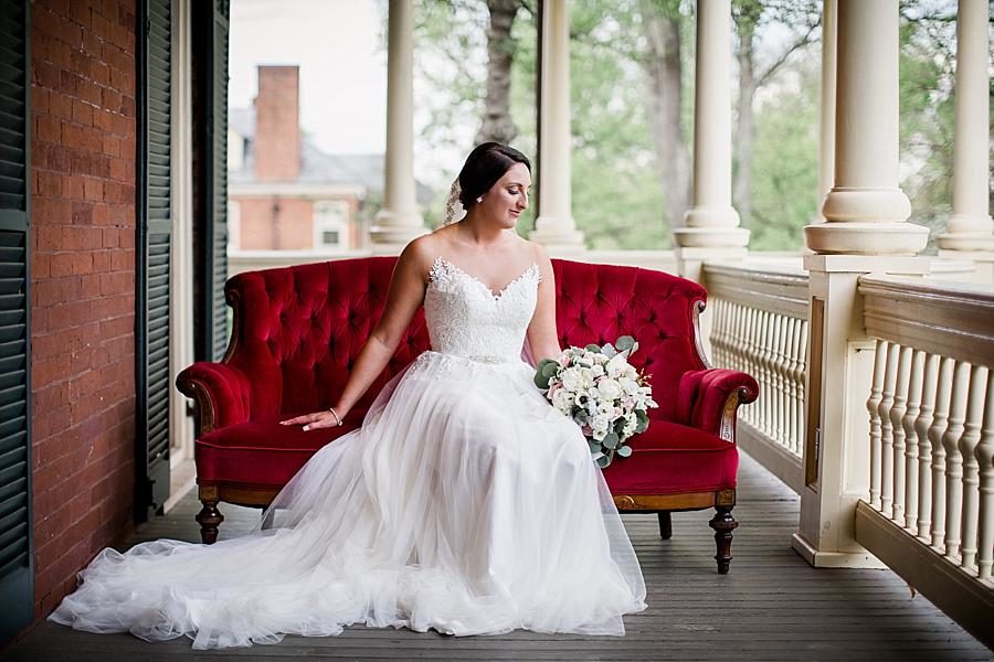 Red velvet couch at this Historic Westwood Bridal Session by Knoxville Wedding Photographer, Amanda May Photos.