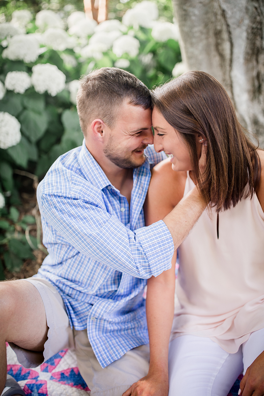 Holding her face laughing at this Estate of Grace engagement session by Knoxville Wedding Photographer, Amanda May Photos.