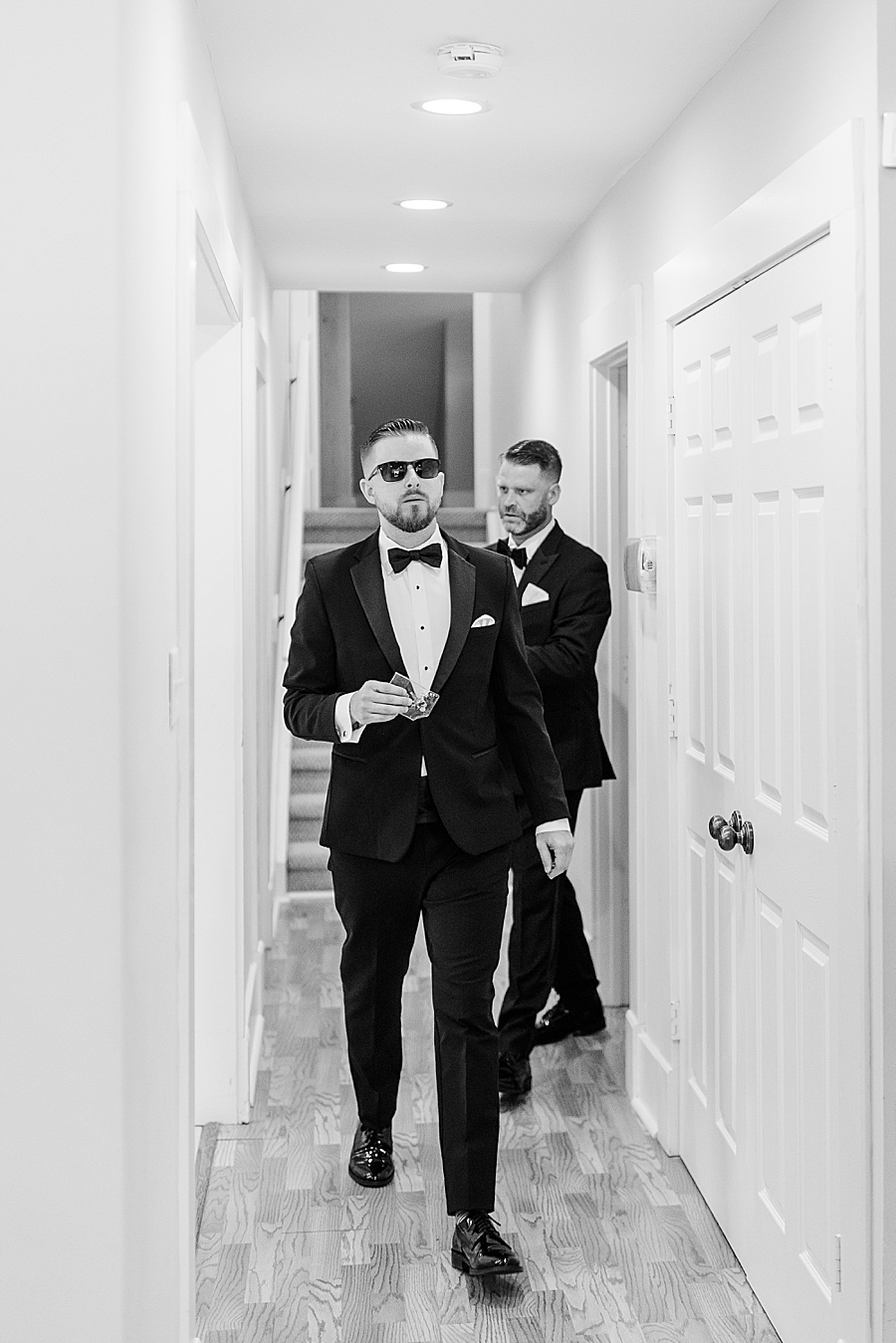 Groom walking down the hall at Marblegate Wedding by Amanda May Photos