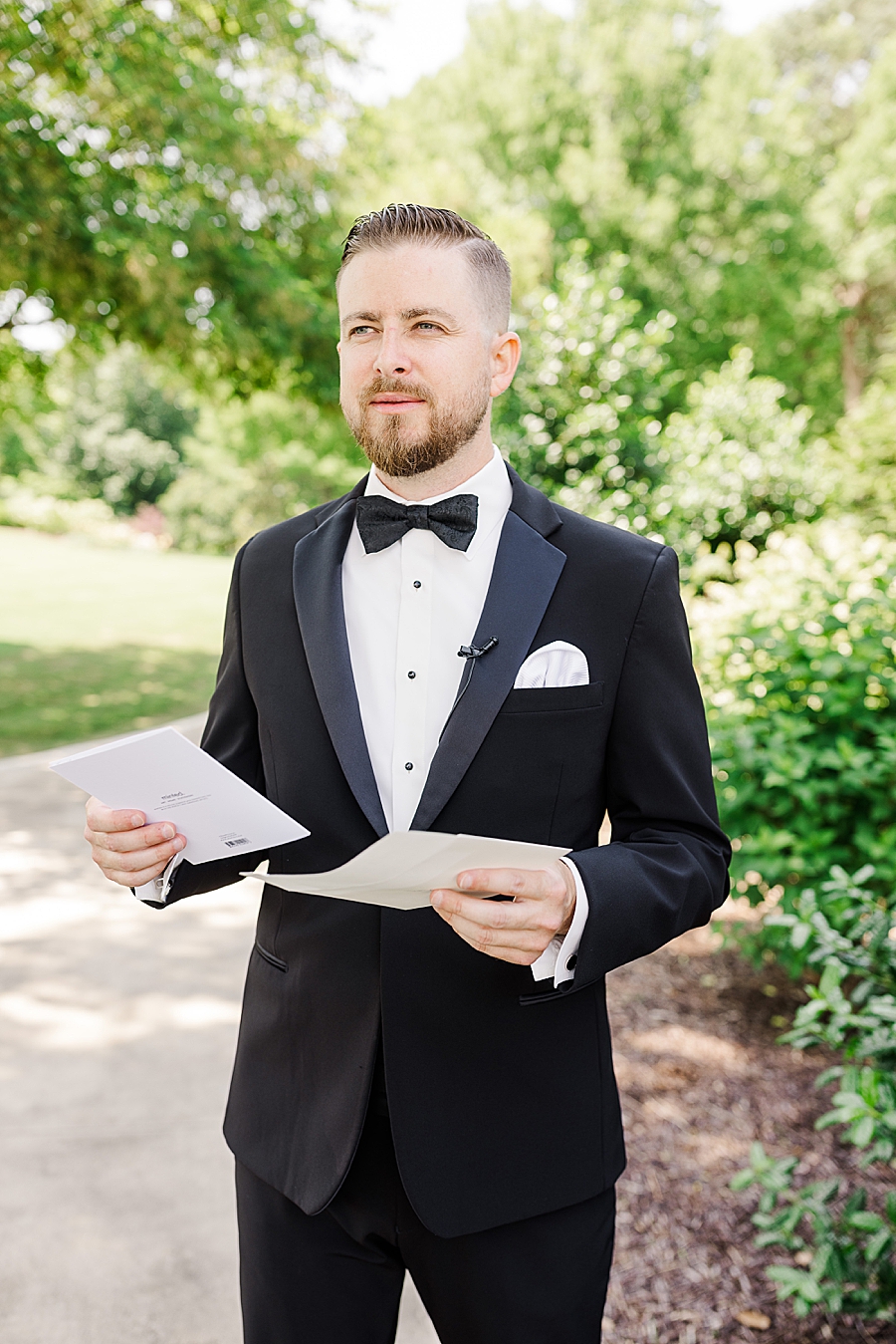 Groom opening letter at Marblegate Wedding by Amanda May Photos