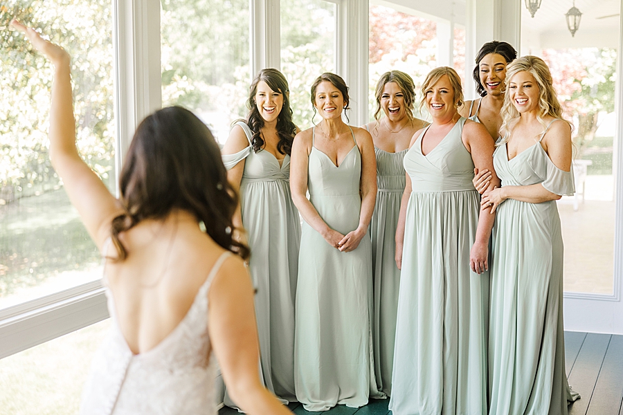 Bridesmaids react to bride at Marblegate Wedding by Amanda May Photos
