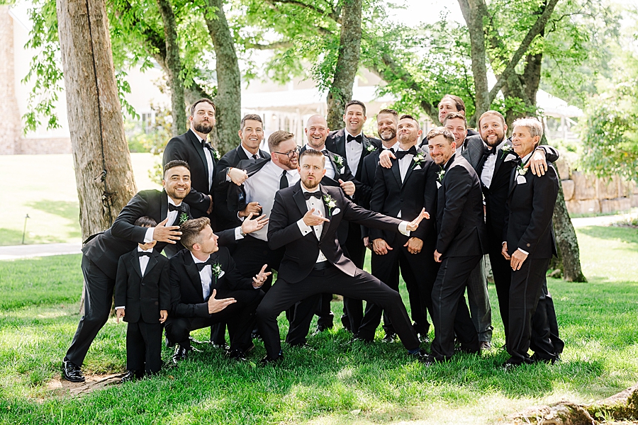 Groom laughing with groomsmen at Marblegate Wedding by Amanda May Photos