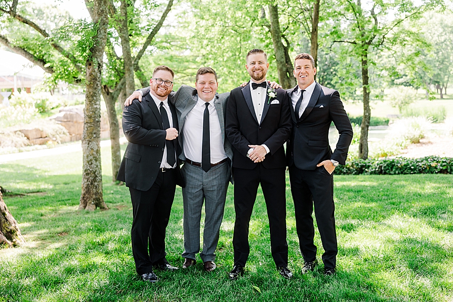 Groom standing with friends at Marblegate Wedding by Amanda May Photos