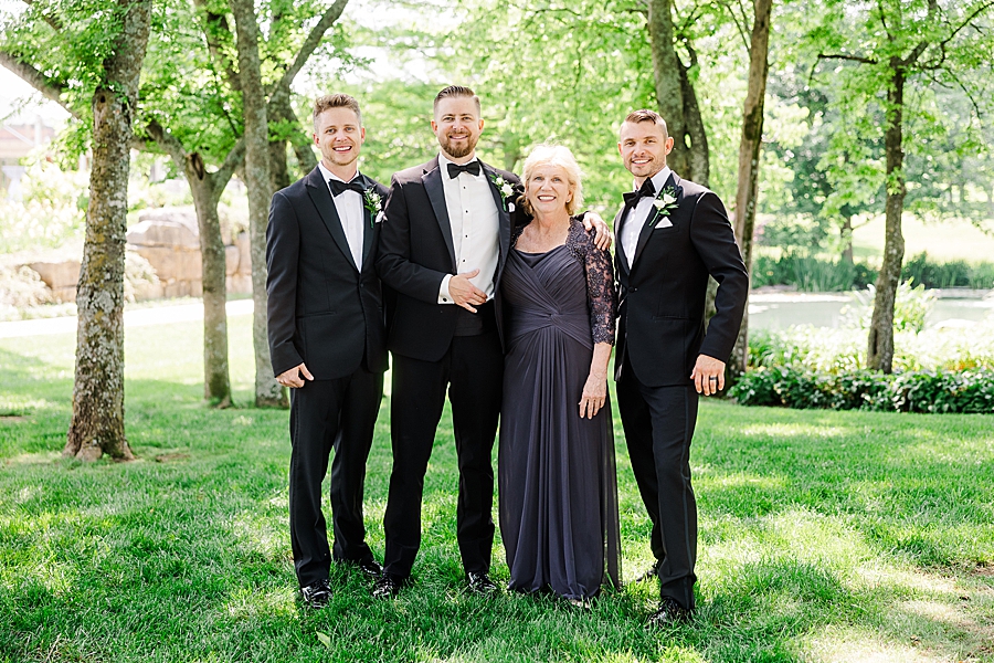 Groom smiling with family at Marblegate Wedding by Amanda May Photos